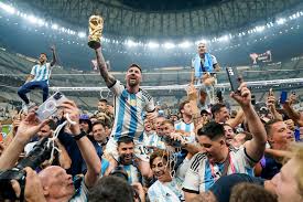 Argentina’s Lionel Messi lifting the World Cup trophy after a victorious final match